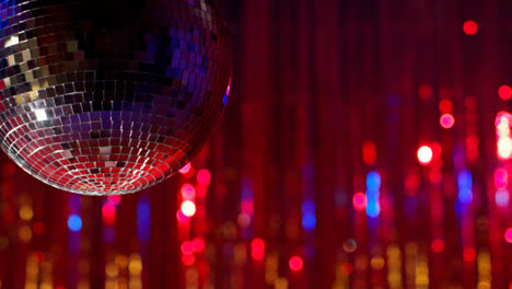 Close-Up-Of-Mirrorball-In-Night-Club-Or-Disco-With-Flashing-Strobe-Lighting-And-Sparkling-Lights-In-Background-2